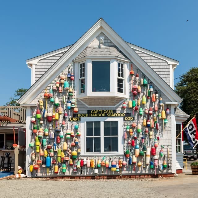 Cap't Cass Rock Harbor Seafood building in Orleans covered in colorful lobster buoys